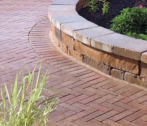 Image of Hanover Prest® Pavers used to build a short wall surrounding a section of plants.